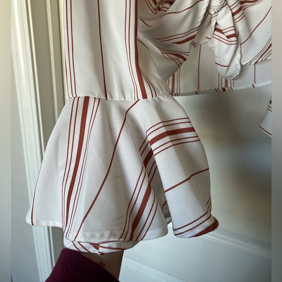 White medium crop top with orange stripes and bell sleeves. Cute and casual. - Picture 3 of 5
